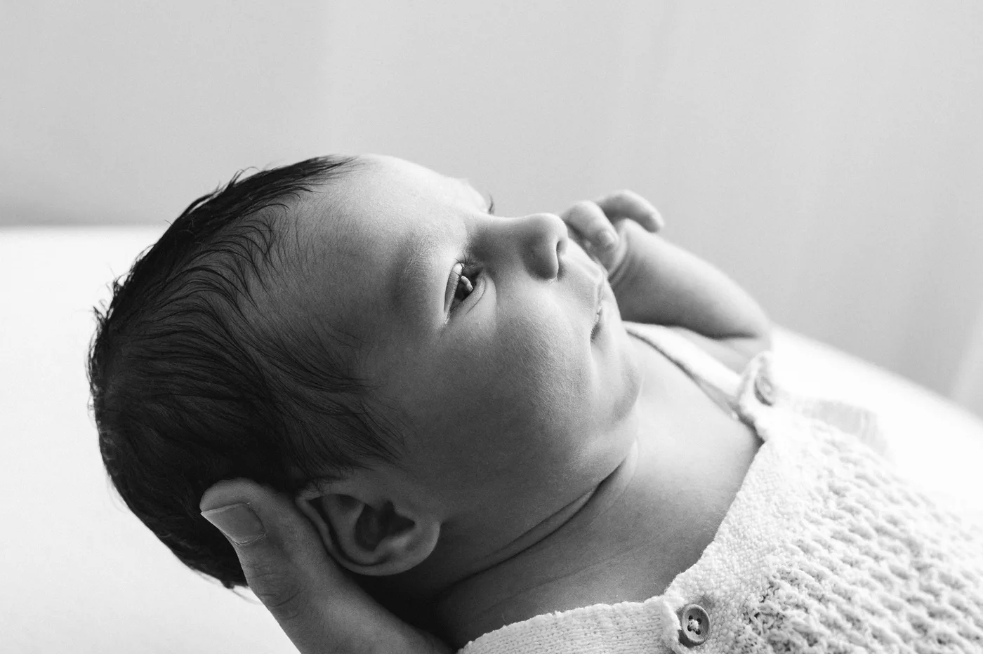 Newborn photographed in monochrome